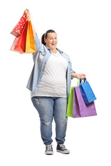 Wall Mural - Happy plus size woman holding shopping bags