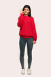 © luismolinero - A full-length shot of a Teenager girl with red sweater showing ok sign with fingers over isolated background