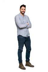 Wall Mural - Full-length shot of Elegant man with shirt with arms crossed and looking forward on isolated white background