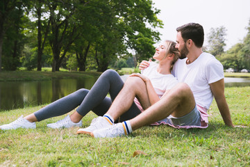 Wall Mural - Lovers enjoy each other in the park.