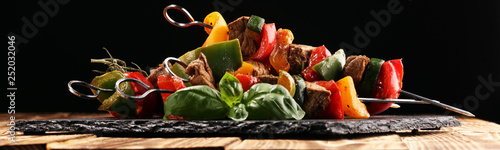 Fotomural Grilled pork shish or kebab on skewers with vegetables