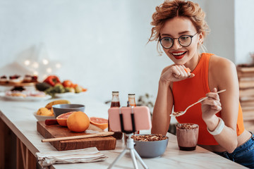 Wall Mural - Positive happy woman smiling to her viewers