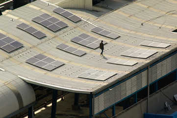 Wall Mural - Solar panels being installed on the roof of delhi metro station