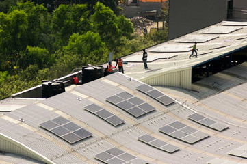 Wall Mural - Solar panels being installed on the roof of delhi metro station