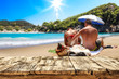 © magdal3na - Desk of free space for your decoration. Beach landscape with two lovers on sand. Summer time.