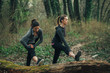 © GAGO IMAGES - Two young beautiful woman exercise in the forest