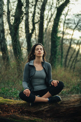 Young beautiful woman exercise in the forest