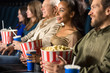 © Nestor - Multi ethnic group of mature people relaxing at the movie theatre