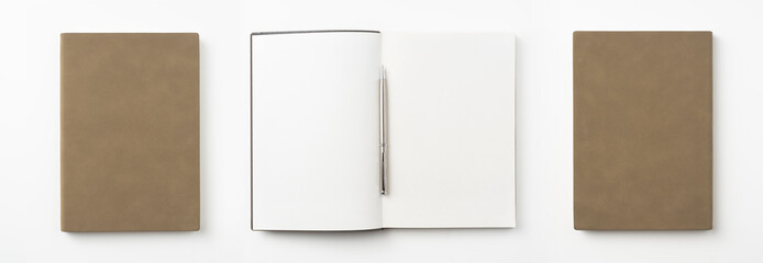 Wall Mural - brown notebook and pen on white background