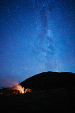 Chile, Tierra Del Fuego, Lago Blanco, People At Campfire Under Starry Sky At Night
