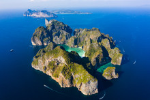 View From Above, Stunning Aerial View Of Koh Phi Phi Lee With The Beautiful Beach Of Maya Bay Bathed By A Turquoise Clear Water And Amazing Ridges Of Limestone Mountains.