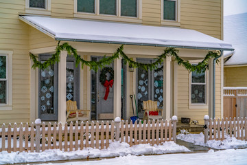 Wall Mural - Facade of home with Christmas decoration in winter