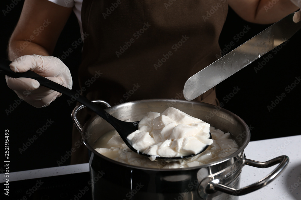 Woman preparing tasty cheese, closeup