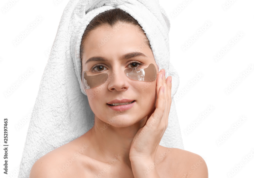 Woman with under-eye patches on white background
