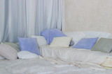 Fototapeta  - Soft interior: curtains, pillows, mattress, soft rug and a blanket