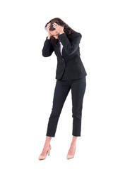 Wall Mural - Worried business woman with head in hands looking down searching for something lost. Full body isolated on white background. 