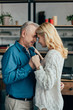 © LIGHTFIELD STUDIOS - happy husband and wife dancing at home