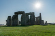 stonehenge in england looking towards sun on a cloud free morning