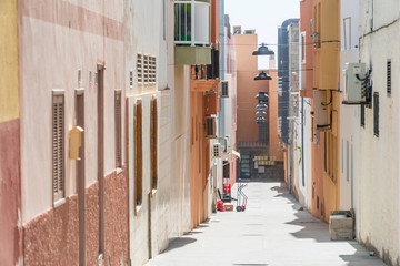 Wall Mural - Narrow street in the city center of Morro Jable, Fuerteventura, Spain