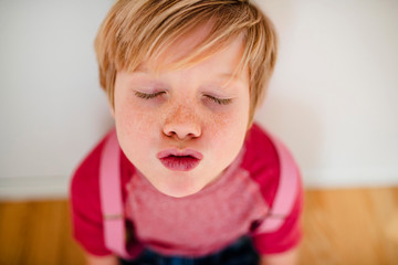 Portrait of a young boy wearing pink