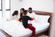 © Monkey Business - Children Bringing Parents Breakfast In Bed To Celebrate Mothers Day Fathers Day Or Birthday