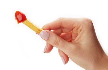 French fries held in fingers isolated on white background