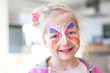 © mmphoto - Portrait of blonde girl smiling with painted face