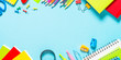 © nadianb - School and office supplies on blue background.