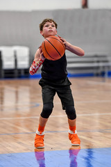 Poster - Young boy playing basketball