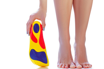 Canvas Print - orthopedic insoles and female feet