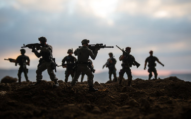 War Concept. Military silhouettes fighting scene on war fog sky background, World War Soldiers Silhouettes Below Cloudy Skyline At night. Attack scene. Armored vehicles. Tanks battle. Decoration