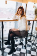 © Andreshkova Nastya - Close up portrait of young hipster modern brunette girl in cafe indoors