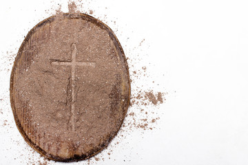 Wall Mural - Cross and ash on white background - symbol of Ash Wednesday.