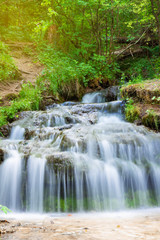  Small forest waterfall in the summer, closeup