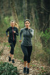 © GAGO IMAGES - Two young beautiful woman exercise in the forest