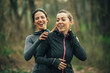 © GAGO IMAGES - Two young beautiful woman exercise in the forest