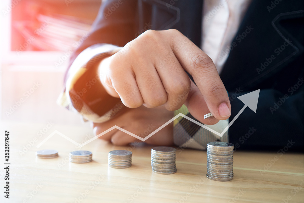 Woman putting coins on stack with holding money, Concept business, finance, money saving and investment - obrazy, fototapety, plakaty 