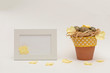Easter composition with eggs, yellow flowers on white background. Eco style. Space for text 