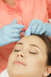© Nestor - Beautiful woman getting beauty injections at the beauty salon