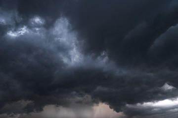 Wall Mural - Scary epic sky with menacing clouds. Hurricane wind with a thunderstorm. Stock background, photo