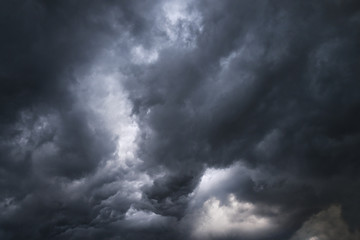 Wall Mural - Scary epic sky with menacing clouds. Hurricane wind with a thunderstorm. Stock background, photo