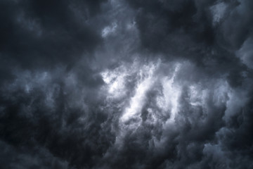 Wall Mural - Scary epic sky with menacing clouds. Hurricane wind with a thunderstorm. Stock background, photo