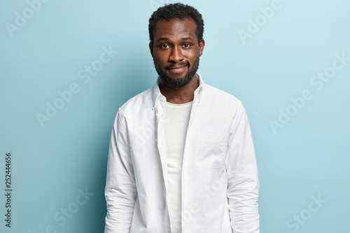Waist Up Shot Of Attractive Black Man With Thick Bristle Curly