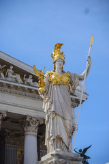 Wall Mural - Austrian parliament building with Athena statue on the front in Vienna on the sunrise