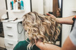 © hedgehog94 - Beautiful hairstyle of mature woman after dying hair and making highlights in hair salon.