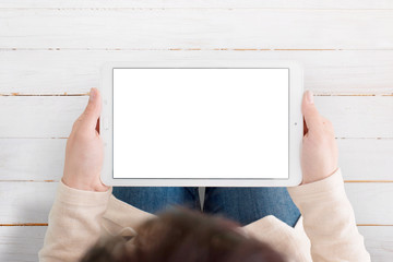 Leinwandbilder - Clean tablet mockup in horizontal position. Simple app presentation concept. Tablet ina woman hands, top view.
