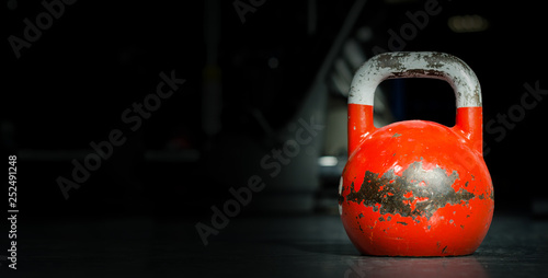 Heavy Old Used Color Kettlebell Weight On The Gym Floor Ready For