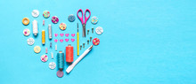 Sewing Thread Set Of Sewing Supplies In Knolling Pattern On Light Blue Background Flat Lay Top View, Template Mockup Hand Made Long Banner