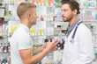 © Zoriana - Pharmacist helping his male customer