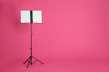Note Stand With Music Sheets On Color Background. Space For Text